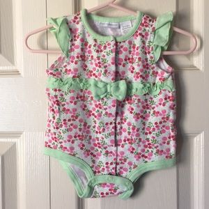 Onesie with ruffles and bow